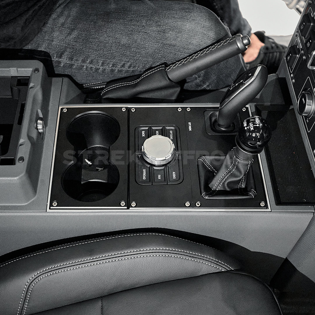 Matte black aluminum cup holder installed in Ineos Grenadier center console
