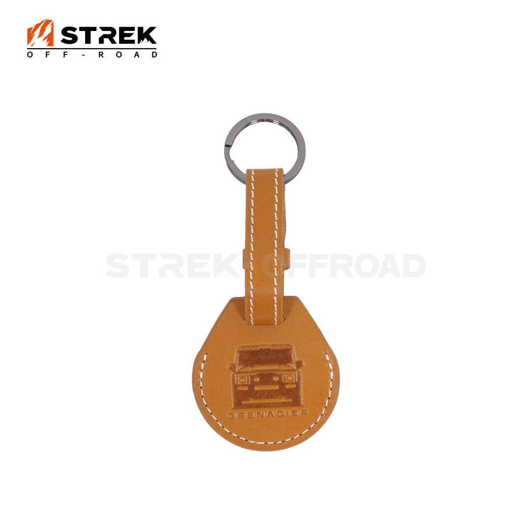 Brown leather keychain with a logo on a white background, featuring the 'STREK OFF-ROAD' brand.
