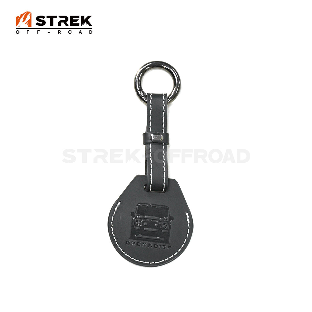 Gray keychain with logo on a white background, featuring the 'STREK OFF-ROAD' brand.