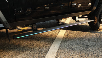 STREK OFF ROAD electric side steps with LED lights installed on INEOS Grenadier showing automatic deployment feature