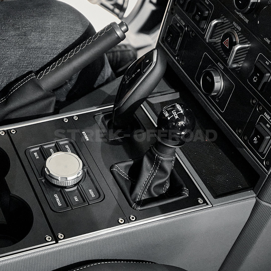 Matte black aluminum cup holder installed in Ineos Grenadier center console