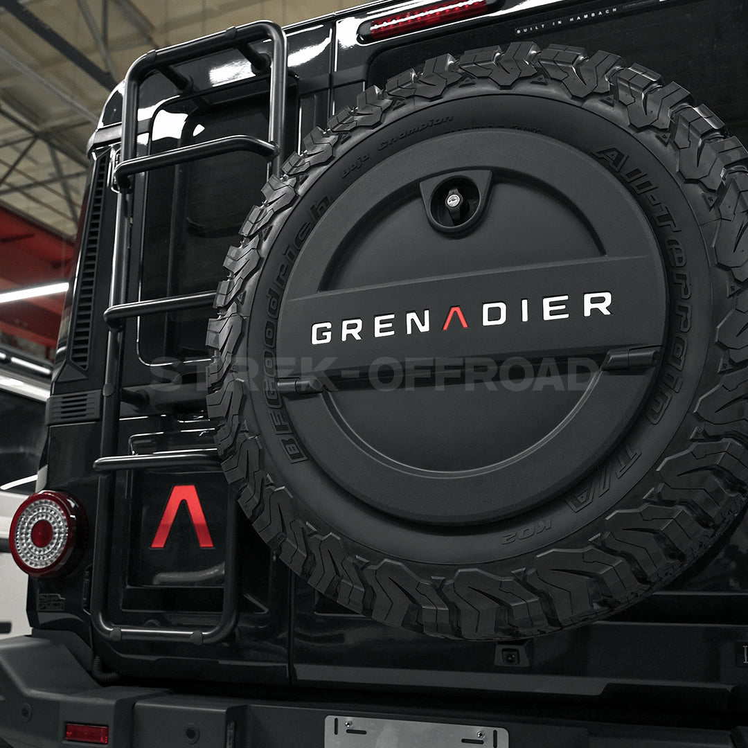 Custom logo stickers installed on Ineos Grenadier hood and tailgate