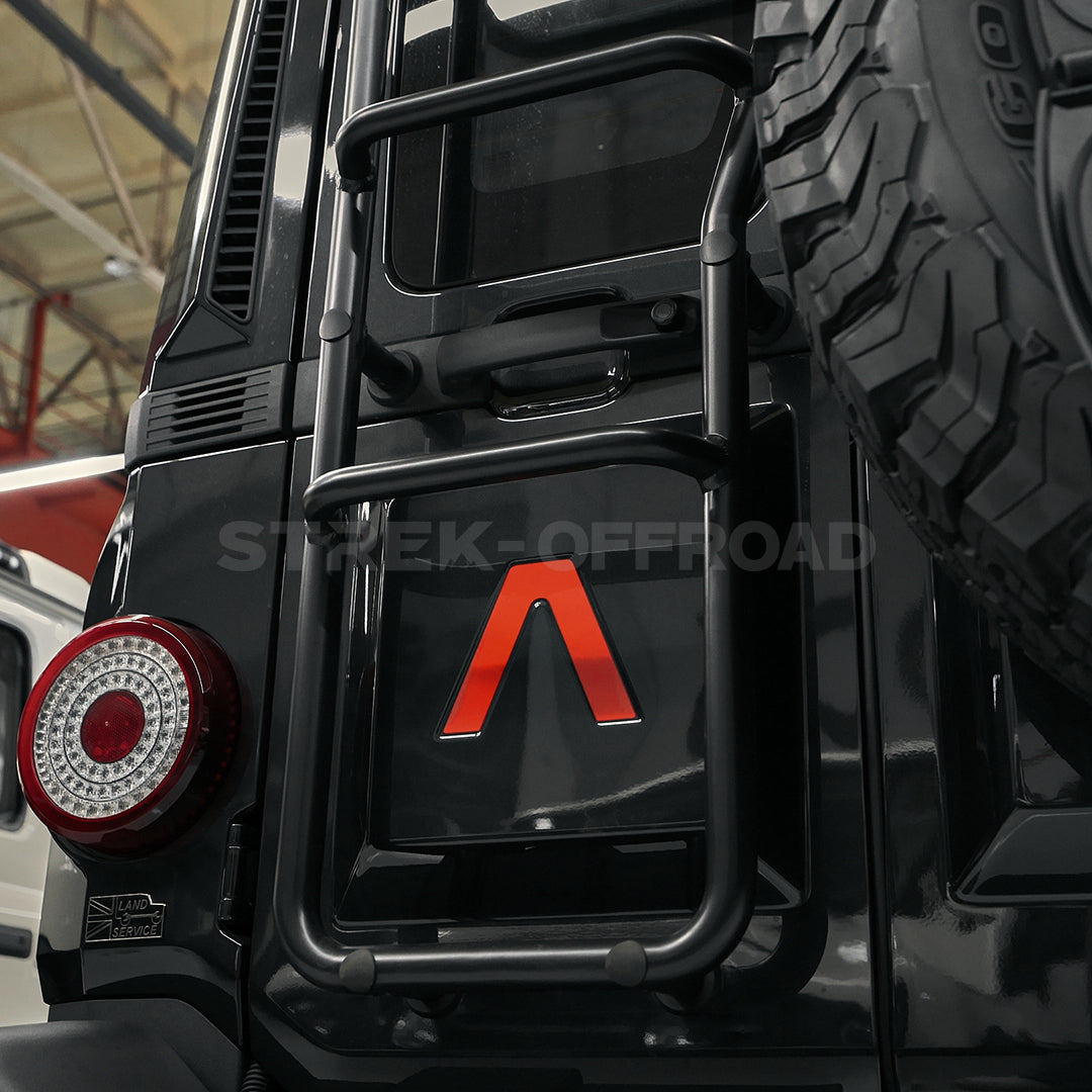Custom logo stickers installed on Ineos Grenadier hood and tailgate
