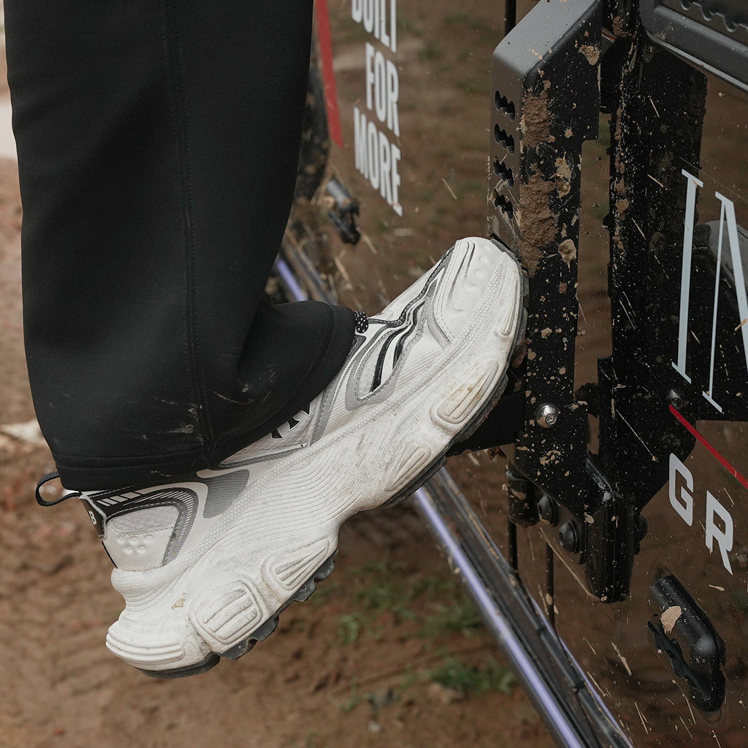 Ineos Grenadier Door Hinge Step black in use, foot on deployed step for rooftop access - Strek Offroad