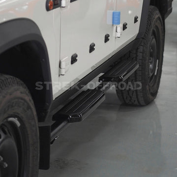 Fixed side steps with Defender styling installed on Ineos Grenadier