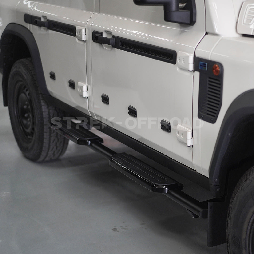 Fixed side steps with Defender styling installed on Ineos Grenadier