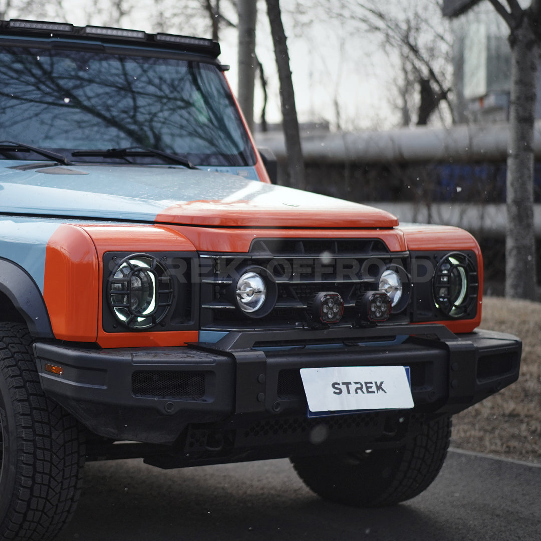 Round LED pod lights installed on Ineos Grenadier front bumper
