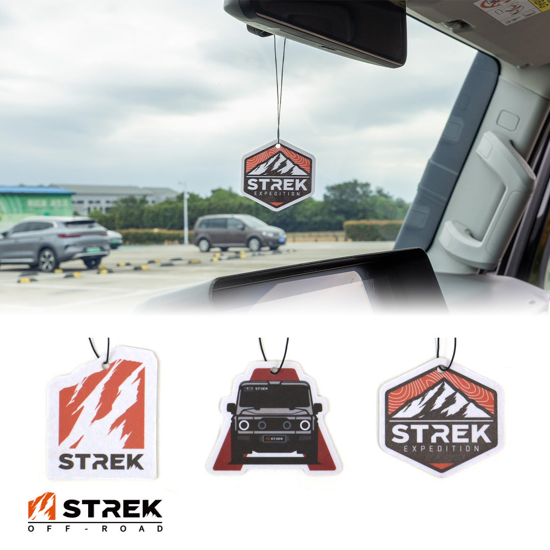 Branded overview graphic for INEOS Grenadier hanging air freshener cards with STREK Expedition Badge installed and Grenadier Silhouette, STREK Claw Logo, and STREK Expedition Badge designs displayed below.