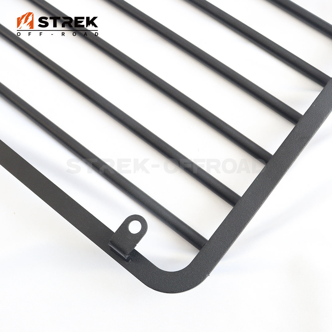 Black metal headlight guards installed on Ineos Grenadier