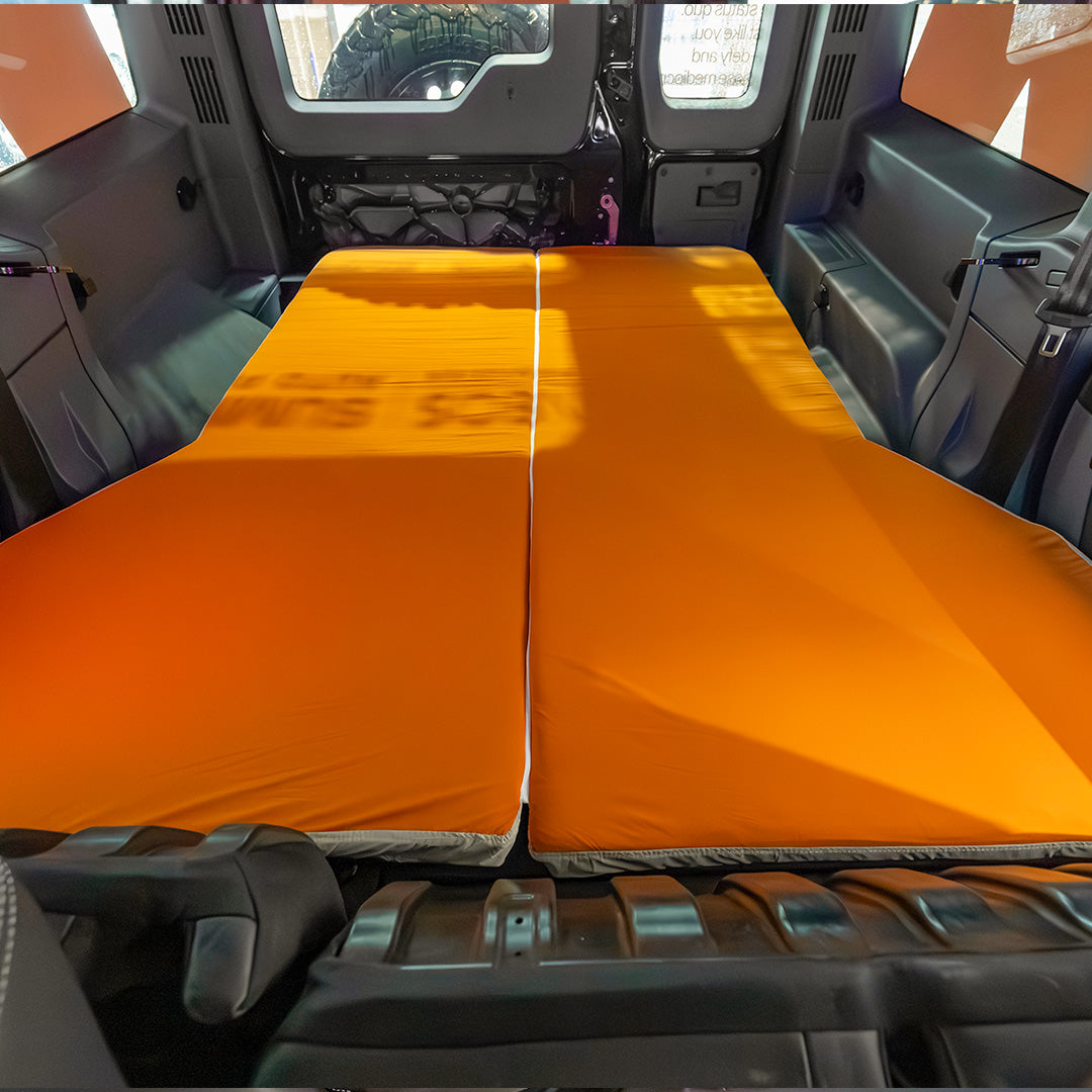 Interior view of the INEOS Grenadier custom sleeping mattress covering the entire width of the rear cargo area.