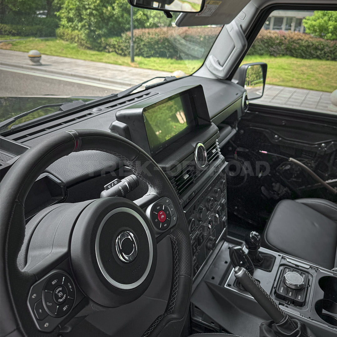 Matte black anti-glare cover installed on Ineos Grenadier dashboard using 3M adhesive
