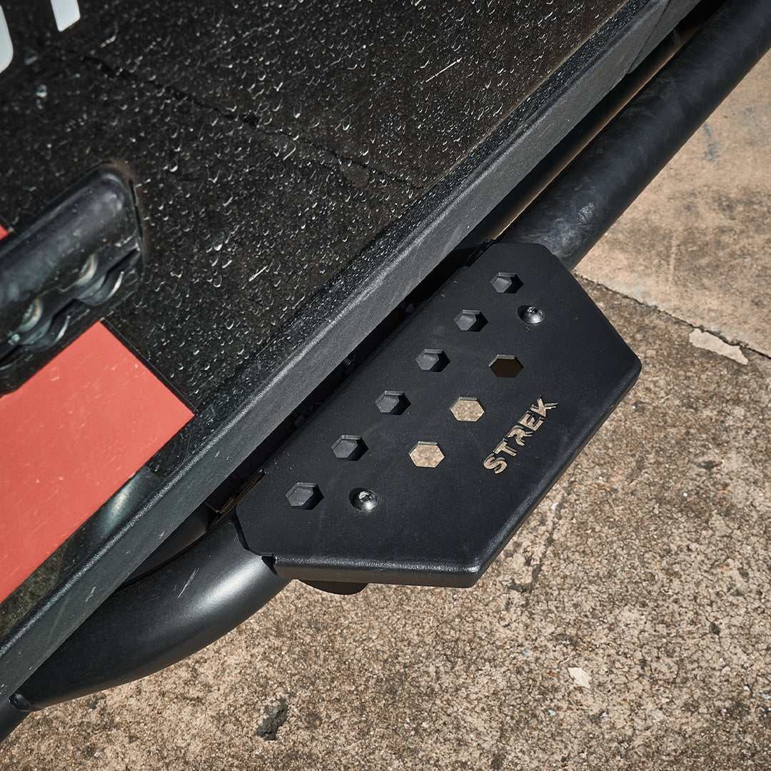 ineos-grenadier-side-steps-rock-slider-clamp-installed-stepping-entry-demonstration-black-boots