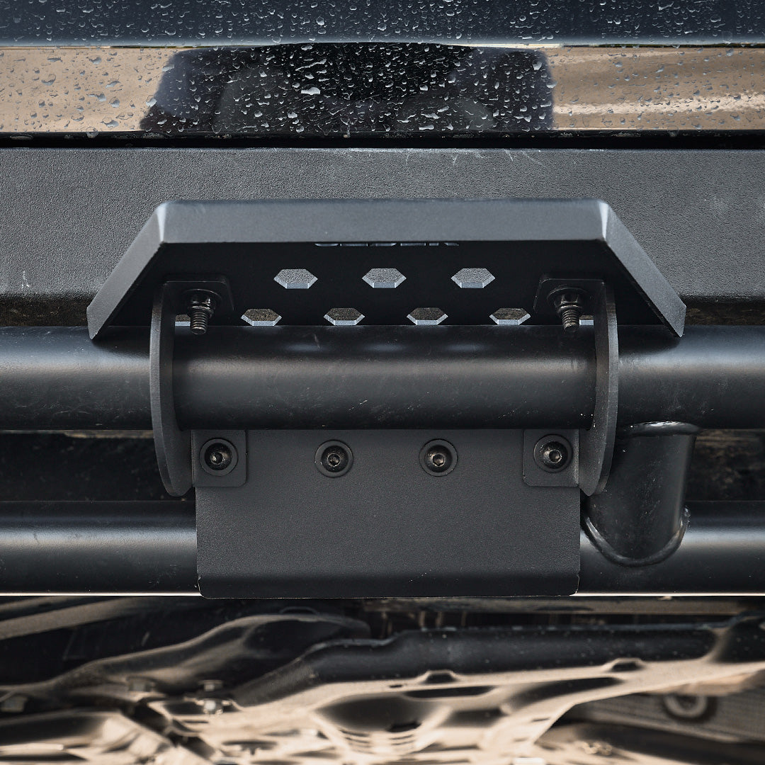 ineos-grenadier-side-steps-rock-slider-clamp-step-plate-installed-underside-angle-demonstrating-clamp-mount