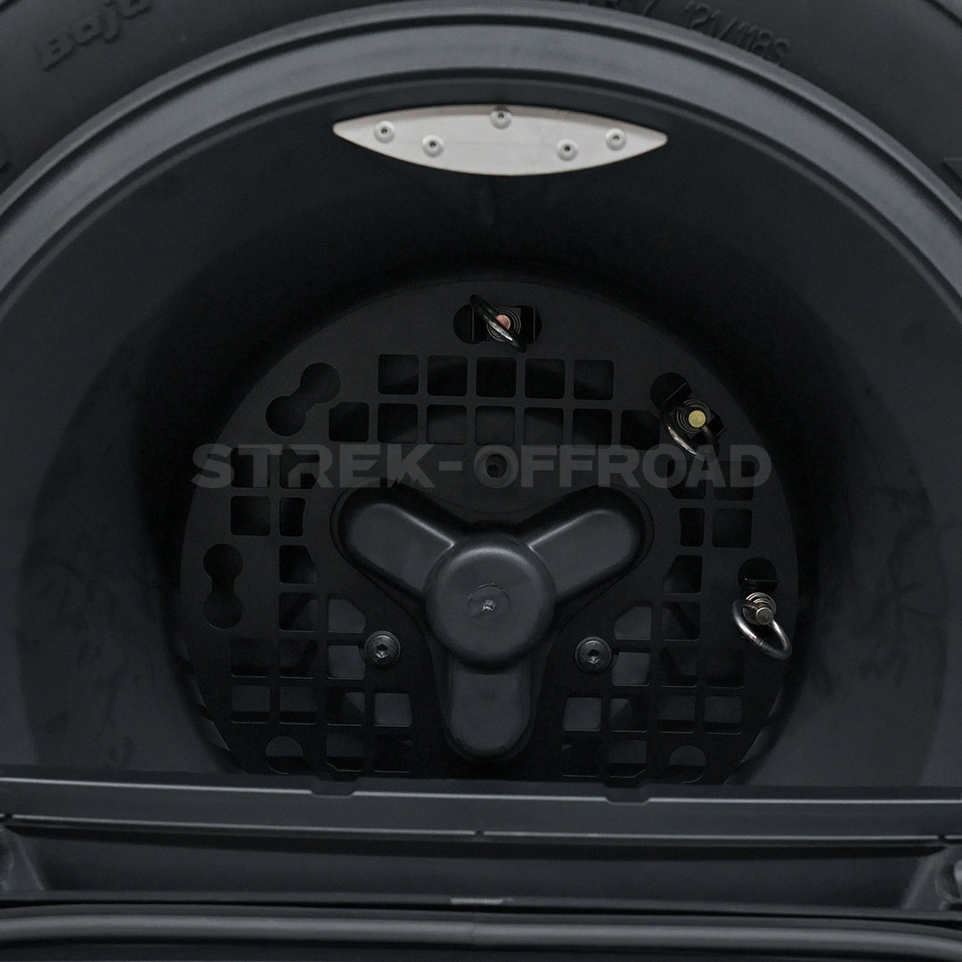 Strek Offroad spare tire expansion plate installed on INEOS Grenadier