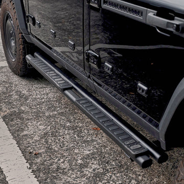 Black fixed aluminum running board installed along the lower side of an INEOS Grenadier.