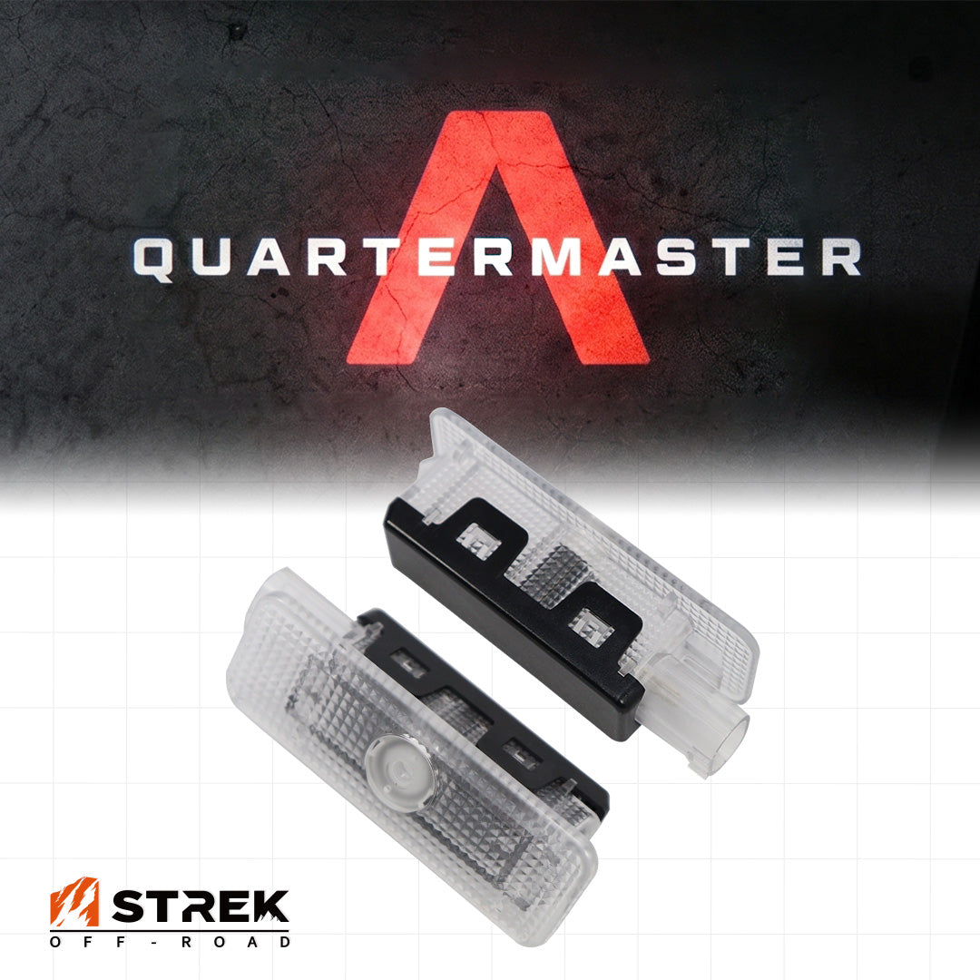 Pair of LED puddle lights with red Quartermaster logo ground projection for INEOS Grenadier Quartermaster.