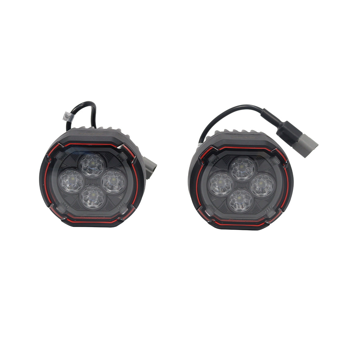 STREK Off Road front bumper round LED pod light kit showing one set of two matching lights, each with four inner projector lenses, red accent ring trim, and rear wiring cables, compatible with INEOS Grenadier.