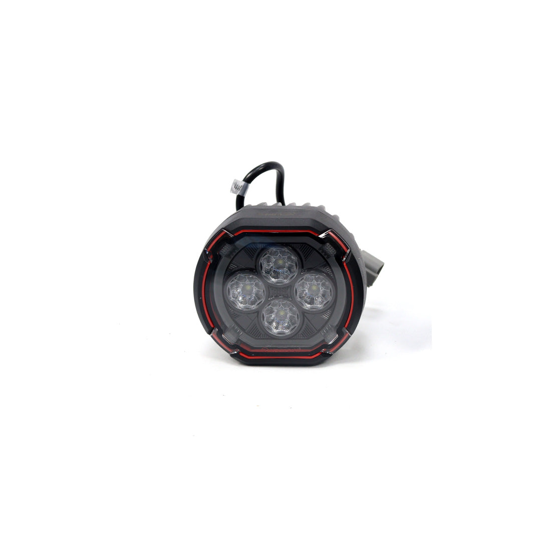 STREK Off Road front bumper round LED pod light showing a single piece, featuring four inner projector lenses, red accent ring trim, and a black wiring connector on a plain white background.