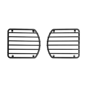 STREK Off Road black metal front headlight guards compatible with INEOS Grenadier, heavy-duty steel protective mesh grilles on a white background.