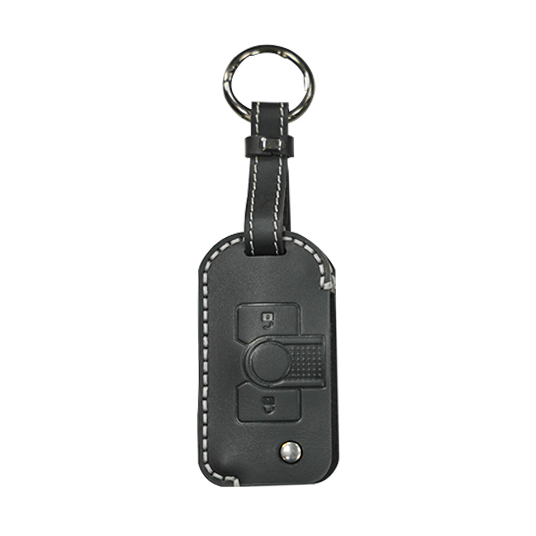 Black leather key fob cover jacket with premium tactile button positioning guides designed for the mechanical profile of the INEOS Grenadier key.