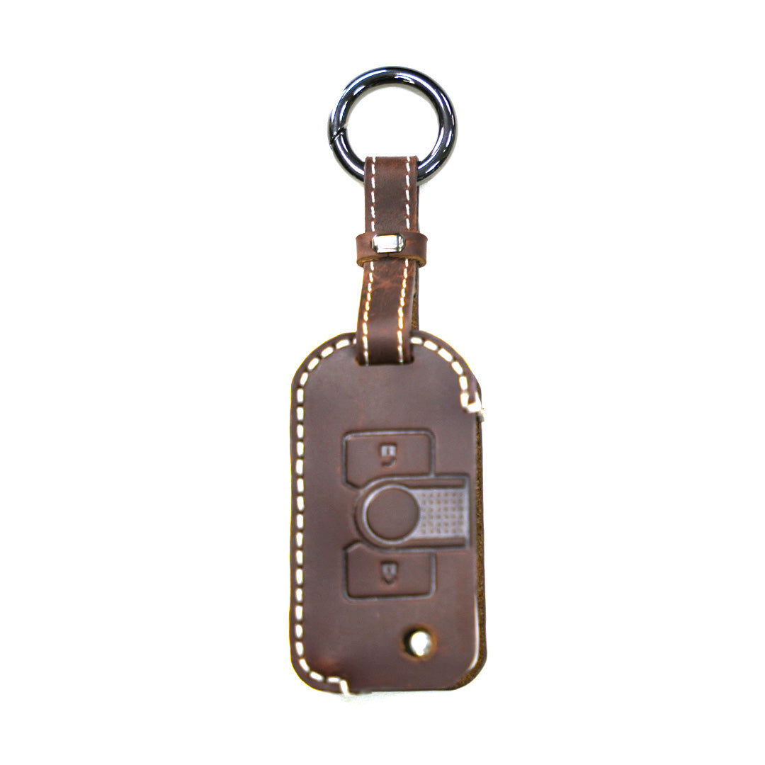 Brown genuine leather key fob protector sleeve with contrasting light stitching and tailored button position alignment designed for INEOS Grenadier owners.