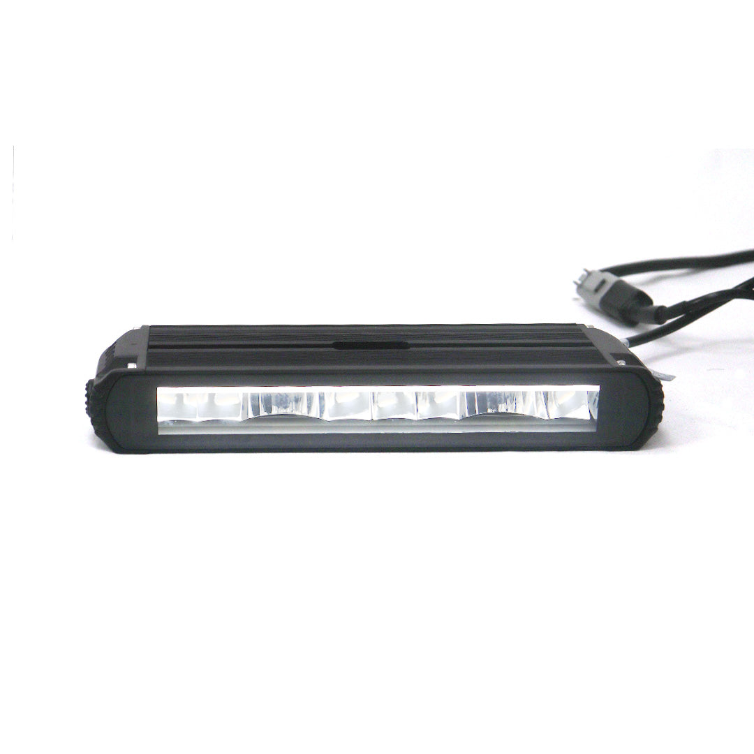 STREK Off Road square LED pod light in active illuminated state, demonstrating the focused beam pattern compatible with INEOS Grenadier front bumper installation.