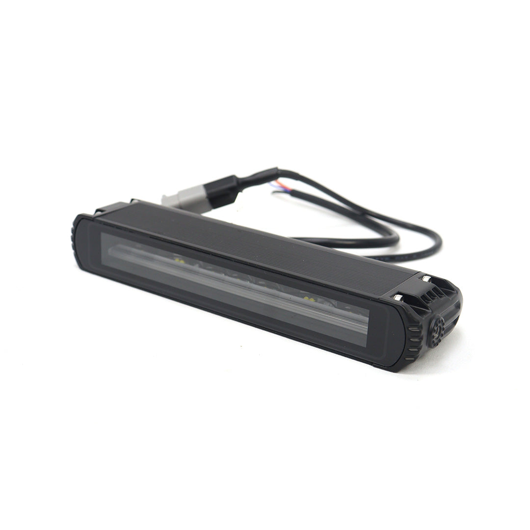 Side profile view of the STREK square LED pod light, highlighting the durable metal frame and compact design for bumper mounting.