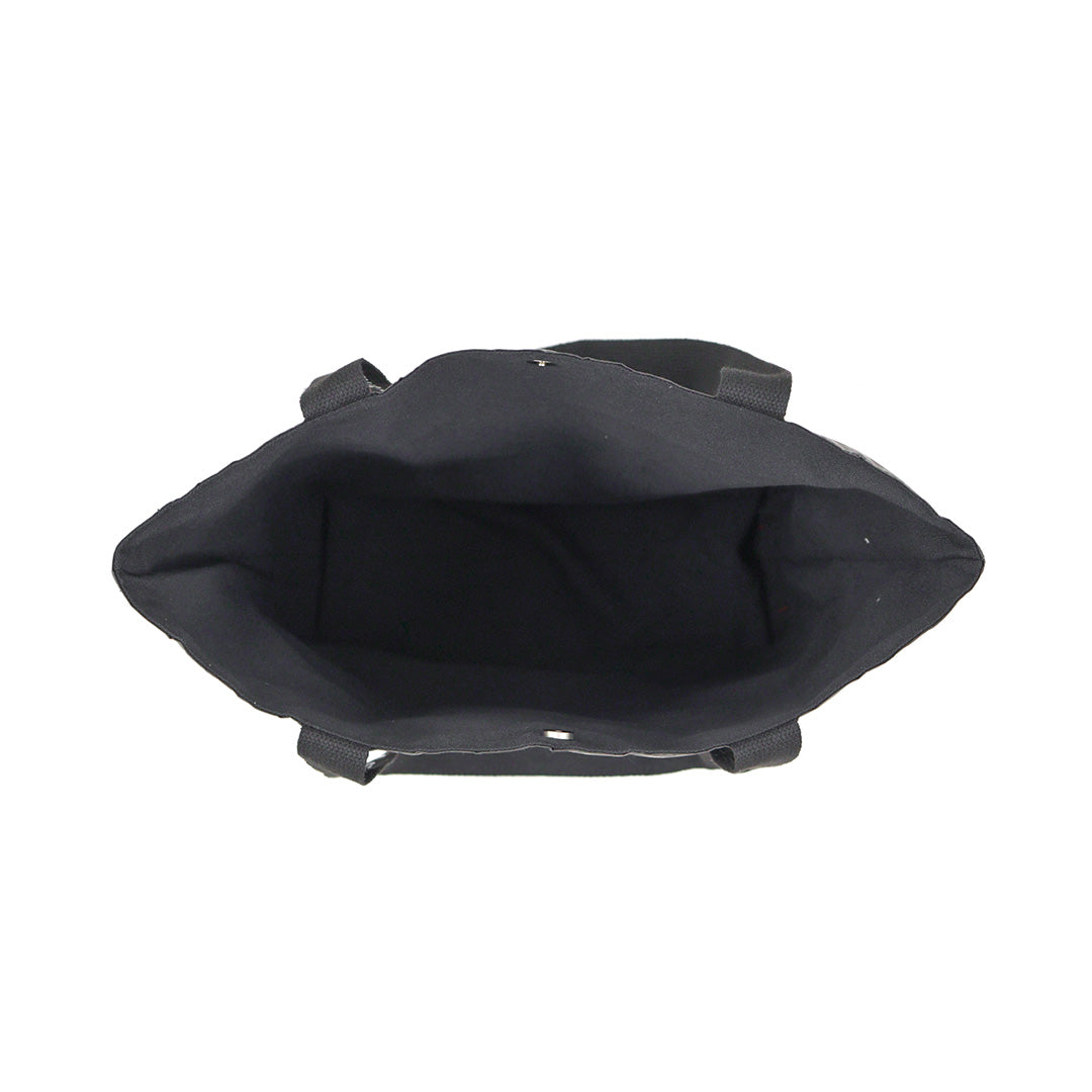 Open top interior view of the STREK Overland Tyvek Utility Tote Bag showing the spacious black inner storage compartment.